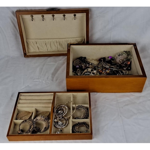 87 - A wooden jewellery box with floral inlay design. Includes assorted jewellery pieces organized within... 