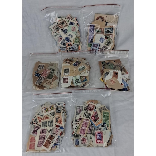 88 - Large mixed lot of assorted postage stamps in ziplock bags. Variety of countries, denominations, and... 