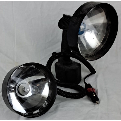 93 - Set of two black handheld spotlights with adjustable stands and coiled power cords.