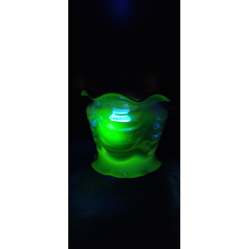 143 - An Unusual Hand-blown uranium glass shade with ruffled rim, featuring gradient shades of pink transi... 