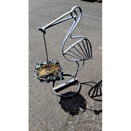 646 - wrought iron planter stand in the shape of a heron, with a hanging basket feature.