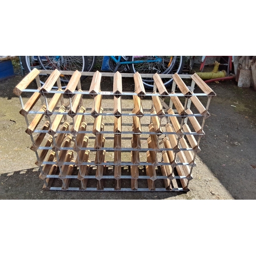 647 - Vintage wooden and metal wine rack with a 30-bottle capacity. It features a grid design for organize... 