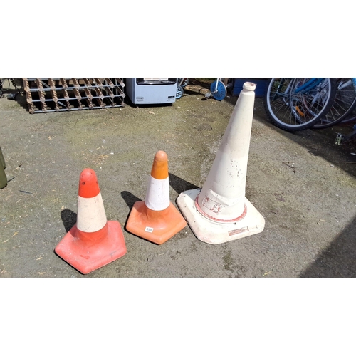 650 - Set of three traffic cones in varying sizes and colors.