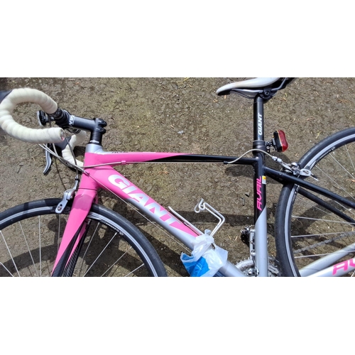 656 - Giant Avail road bike, featuring a pink and black aluminum frame, Shimano components, and drop handl... 