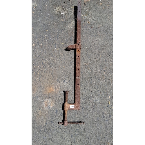 665 - Vintage metal bar clamp with adjustable screw mechanism and multiple positioning holes.