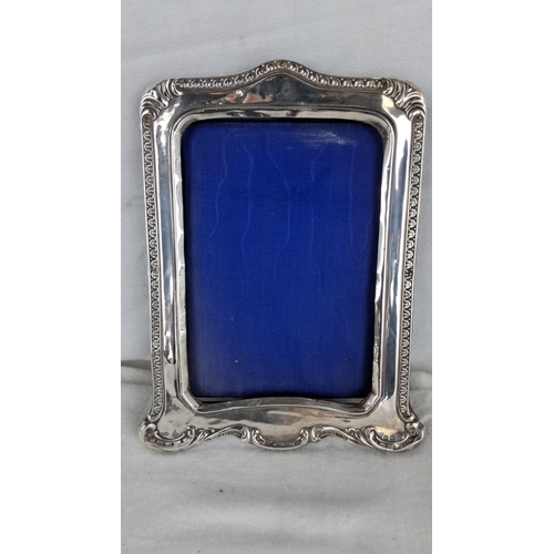 1184 - Sterling Silver photo frame with intricate scrolling details. Early 20th-century design.