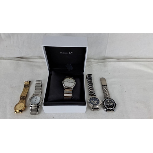 1188 - Set of five wristwatches, featuring different styles and brands, including a boxed watch. Mix of sta... 