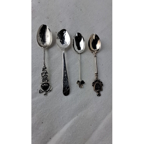 1190 - Set of four antique Sterling Silver spoons with intricate designs and hallmarks. Each spoon showcase... 