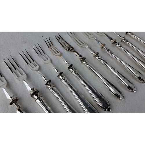 1191 - Set of twelve sterling silver dessert forks with decorative handles, likely from the early to mid-20... 