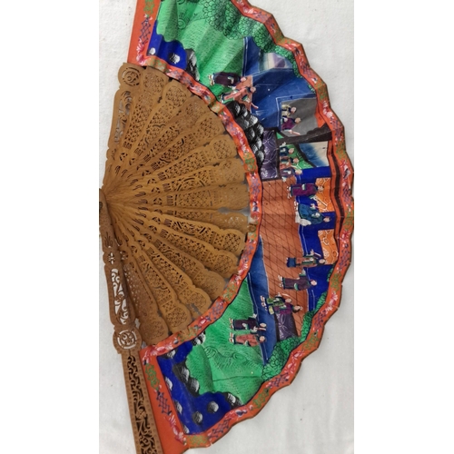 1194 - Carved wooden oriental hand fan with colorful painted scenes. Includes traditional figures and lands... 