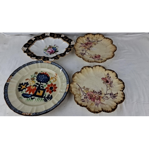 1203 - Set of four decorative floral plates with hand-painted designs. Scalloped and patterned edges that i... 