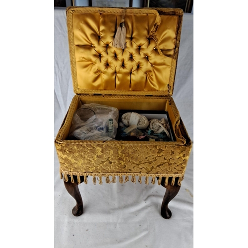 1208 - Victorian-style sewing box with tufted satin interior, gold floral upholstery, tassel trim, and cabr... 