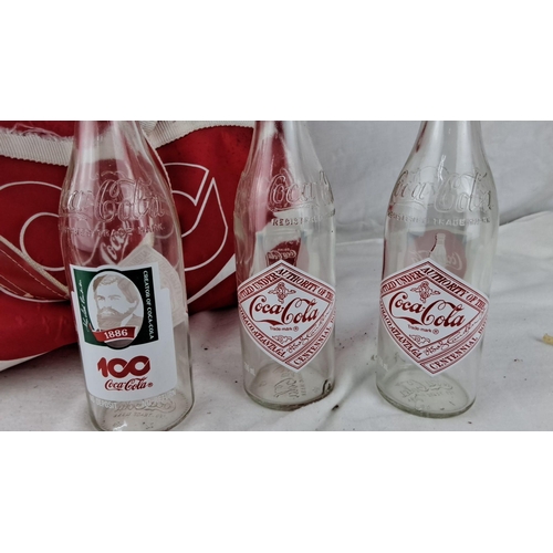 1209 - This lot from the 1970s includes commemorative 100th anniversary Coca-Cola bottles and a vintage red... 