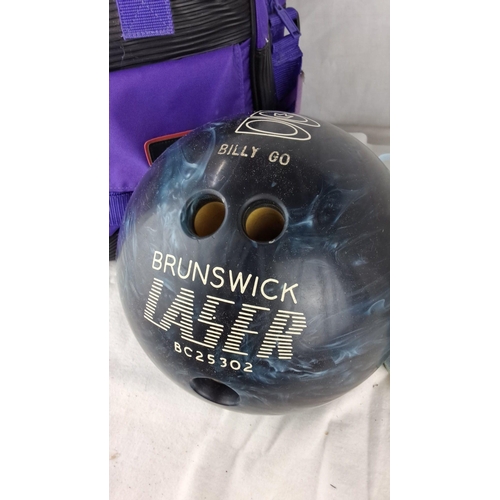 1210 - Bowling equipment set including a Brunswick Laser bowling ball (BC25302), AMF branded purple bag, an... 