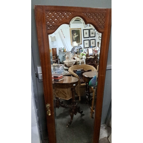 1214 - Victorian mahogany framed mirror with carved geometric design, brass escutcheon, and beveled glass. ... 