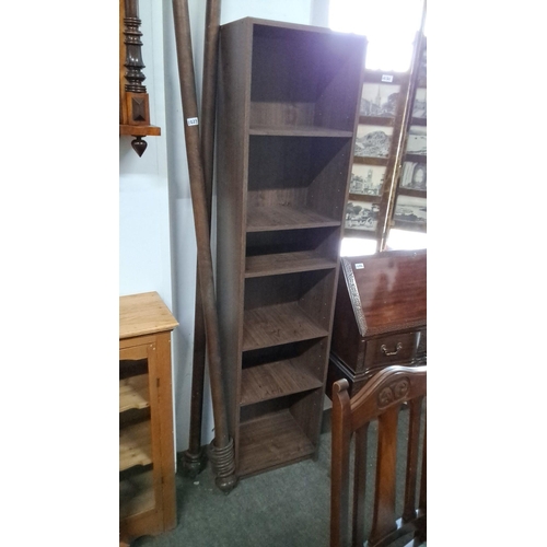 1230 - Tall wooden bookcase with four adjustable shelves, featuring a dark oak finish.  Measuring 42x29x180... 