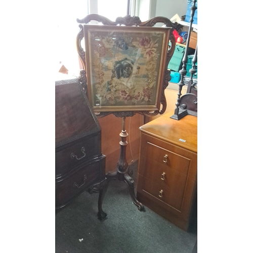 1233 - Victorian firescreen with needlepoint panel, depicting a dog and floral motifs. Features intricately... 