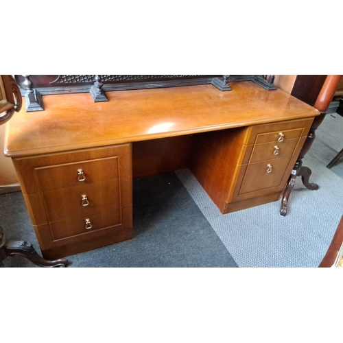 1238 - Mid-Century Modern wooden desk with six drawers, showcasing a warm finish and simple, sleek lines ty... 