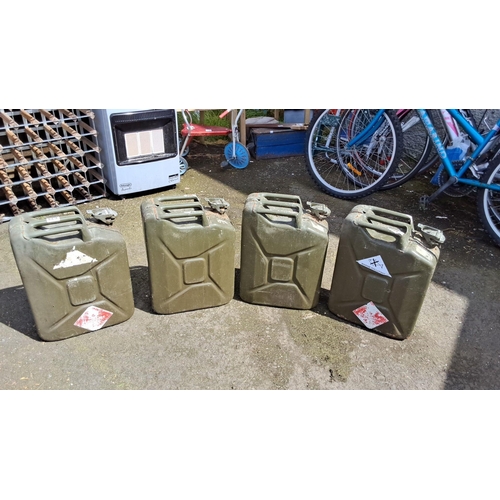 639 - Set of four vintage British military metal jerry cans. Olive green colour with hazard labels. Featur... 