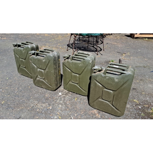 642 - Set of four green vintage British military metal jerry cans. Each marked with production year.