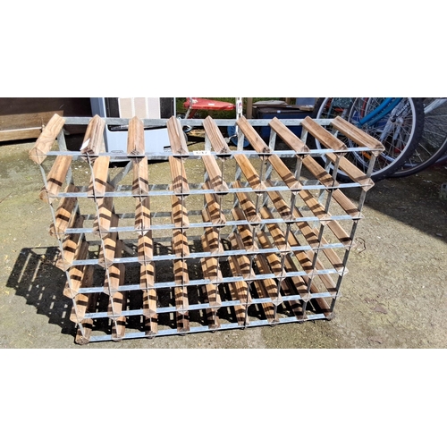 647 - Vintage wooden and metal wine rack with a 30-bottle capacity. It features a grid design for organize... 