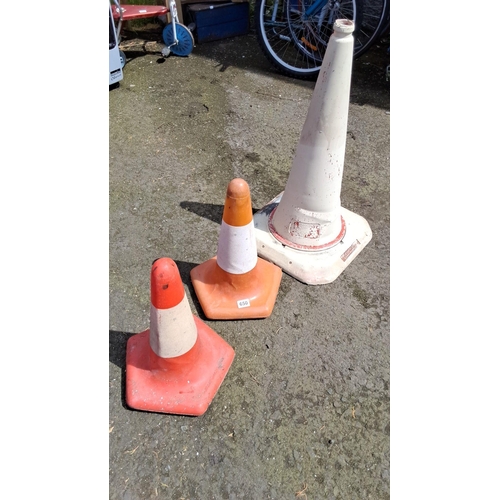 650 - Set of three traffic cones in varying sizes and colors.