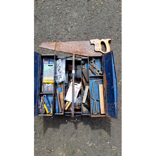 653 - Vintage metal toolbox containing assorted hand tools and accessories. These include a handsaw, vario... 