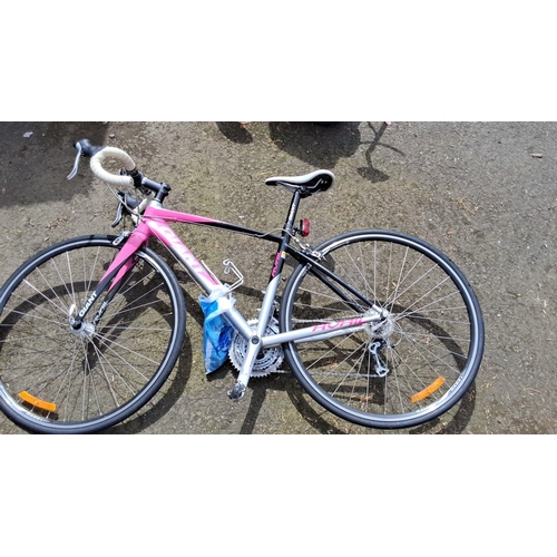 656 - Giant Avail road bike, featuring a pink and black aluminum frame, Shimano components, and drop handl... 