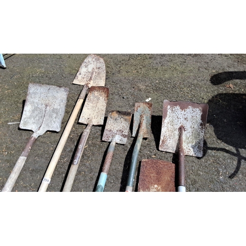 662 - Collection of seven assorted garden spades and shovels featuring wooden and metal handles.