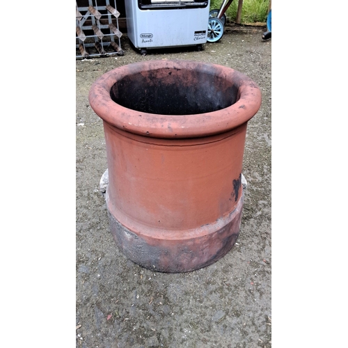 666 - Large terracotta chimney pot, traditional cylindrical design with a rolled rim.