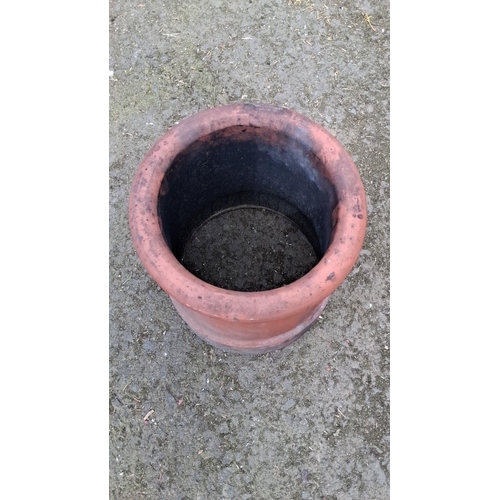 666 - Large terracotta chimney pot, traditional cylindrical design with a rolled rim.