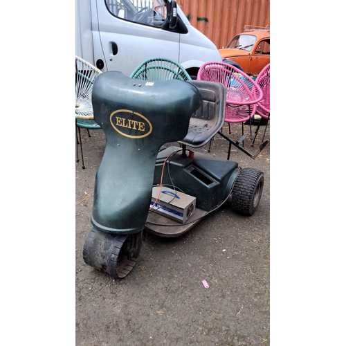 672 - Elite Mobility Scooter, green model with a cushioned seat and a three-wheel design. Includes an atta... 