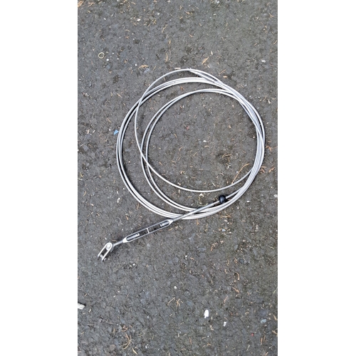 673 - Stainless steel wire rope with swage fork end fitting. Measures approximately 3 meters in length.