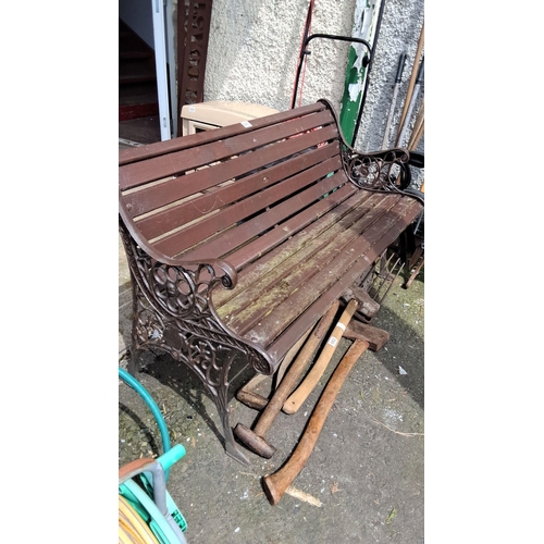 681 - Garden bench featuring Victorian-style ornamental cast iron sides and slatted wooden seat. Comes wit... 