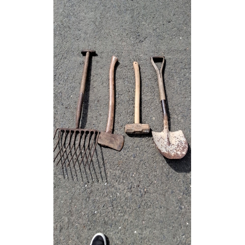 682 - Set of four vintage farm tools including a rake, hoe, mallet, and shovel. Handles are made of wood w... 