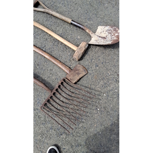 682 - Set of four vintage farm tools including a rake, hoe, mallet, and shovel. Handles are made of wood w... 