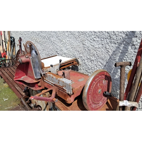 687 - Vintage Red Industrial Bacon slicer Saw. Features durable cast iron construction and a large circula... 