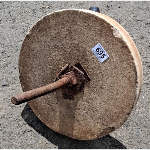 695 - Grinding wheel with rusted metal mount. Circular stone grinder.