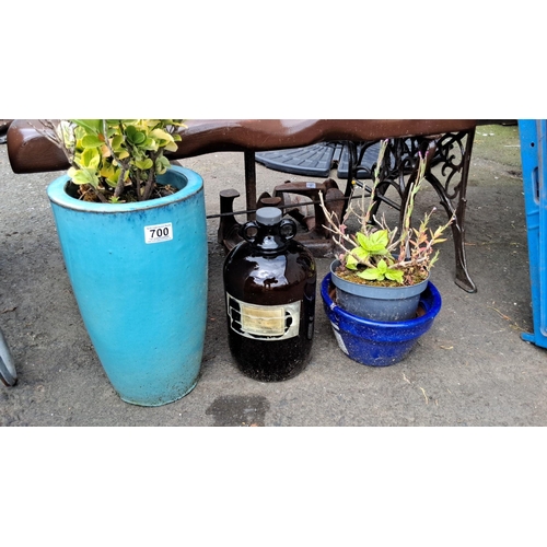 700 - a large turquoise ceramic planter, an amber glass demi john bottle, and a blue planter.