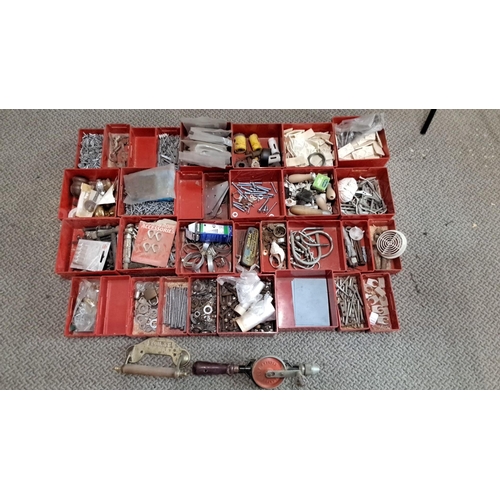 733 - Assorted hardware in red compartments. The set consists of nails, screws, fasteners, latches, and va... 