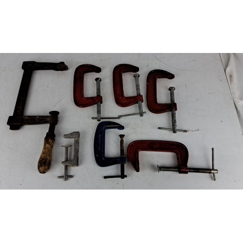 738 - Assortment of seven vintage C-clamps in various sizes and colors. Includes metal and wood handles. S... 