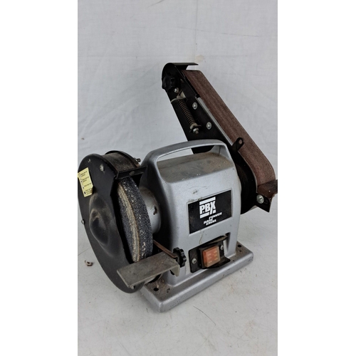 744 - Power Base Excel bench grinder with attached belt sander. Includes a grinding wheel and abrasive bel... 