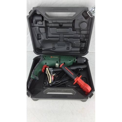 756 - Parkside hammer drill in carrying case. Features ergonomic design and multiple accessories. Comes wi... 