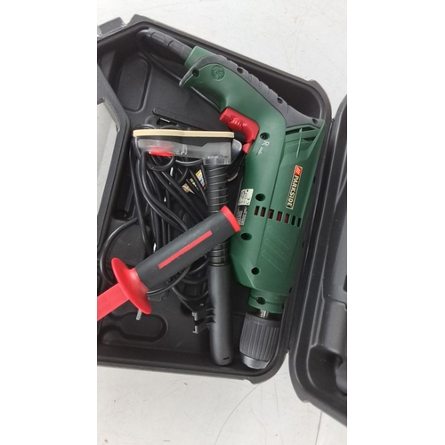 756 - Parkside hammer drill in carrying case. Features ergonomic design and multiple accessories. Comes wi... 