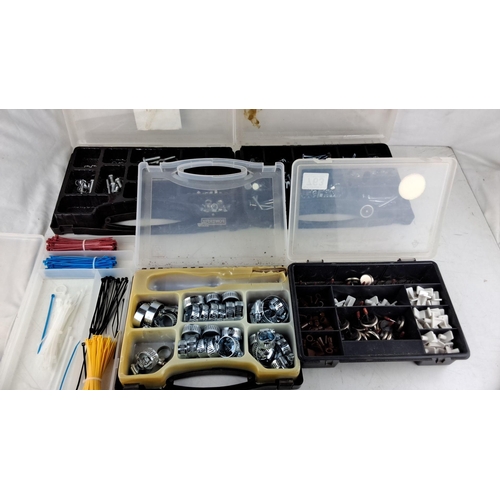 763 - Two organizer boxes containing assorted nuts, bolts, and screws, and two additional boxes with vario... 