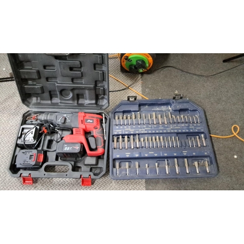 764 - Cordless hammer drill with 88V battery. Includes a charging station and an extensive bit set in a se... 