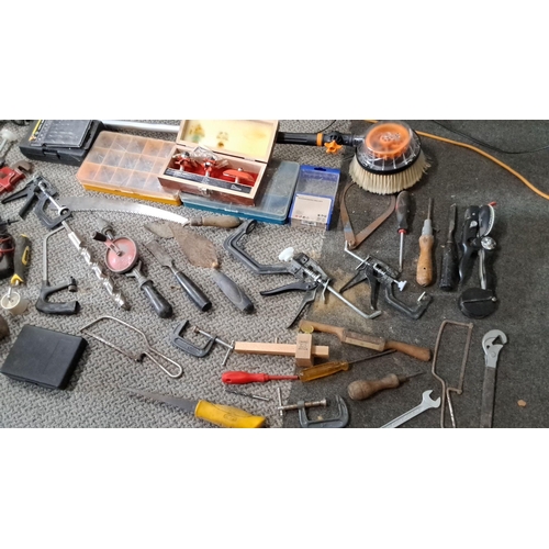 776 - Assorted tools including clamps, screwdrivers, measuring tools, a saw, hammers, and a boxed set of r... 