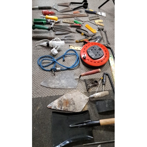 778 - Mixed lot of assorted hand tools. Includes trowels, shears, pliers, measuring tape, and an extension... 