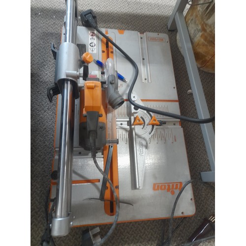 711 - Triton Workcentre Twx7 Contractor Saw with accessories, featuring robust metal construction and prec... 