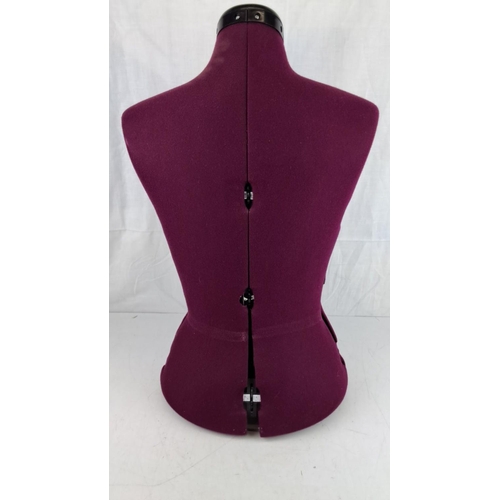 1 - Adjustable dress form in deep burgundy fabric with black plastic neck and base, showcasing a front s... 